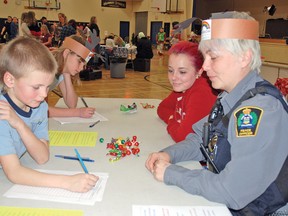 Mason Chase, 7, and his sister Katelynn, 11, sign up to volunteer for a new program called A Helping Hand on Saturday, Dec. 6 at the Cultural-Recreational Centre during the inaugural Snowflake Festival. Vulcan’s peace officer Loreli Hornby, pictured with her daughter Makayla, 17, decided to get a local program going to help people who are physically unable to clear their sidewalks. It will be a year-long program, also providing volunteers to help with physically demanding chores like raking leaves or other lawn maintenance for residents who aren’t physically able to do it themselves and might not be able to afford to pay someone else to do it. 
Simon Ducatel, Vulcan Advocate