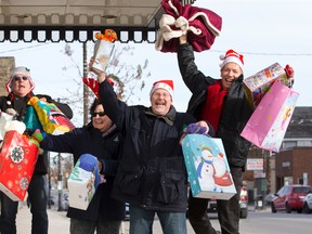 South London friends Tim Nesseth, left, Jane Nesseth, Richard Martin and Donald D?Haene are embracing the holiday season by surprising residents of an area seniors? home with gifts. (CRAIG GLOVER, The London Free Press)