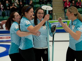 Team Sweeting lead Dana Ferguson, left, and second Rachelle Brown celebrate their Canada Cup championship with skip Val Sweeting and third Lori Olson-Johns. (Michael Burns, CCA)