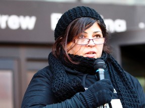 Michael MacIsaac's widow, Marianne, speaks during a rally on Sunday.
(DAVE ABEL, Toronto Sun)