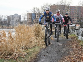 Queen's Cycling team members Etienne Moreau, lead, Cameron McPhaden and Jeff Waters cycle along the path near Doug Fluhrer Park on Saturday. The team trains throughout winter for competitions in the spring. (Julia McKay/The Whig-Standard)
