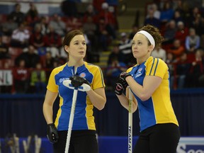 Rachelle Brown, left, chats with former teammate Joanne Courtney at last springs Scotties in Montreal. (QMI Agency)