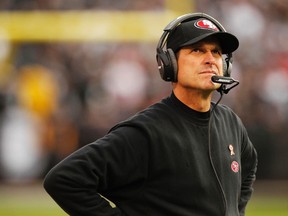 San Francisco 49ers head coach Jim Harbaugh looks towards the scoreboard during a break in the action against the Oakland Raiders in the fourth quarter at O.co Coliseum on Dec 7, 2014 in Oakland, CA, USA. (Cary Edmondson/USA TODAY Sports)
