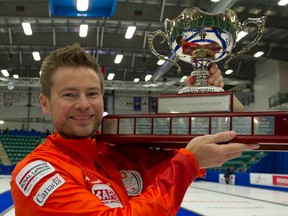 Mike McEwen poses with the Canada Cup in Camrose Sunday. (Michael Burns, CCA)