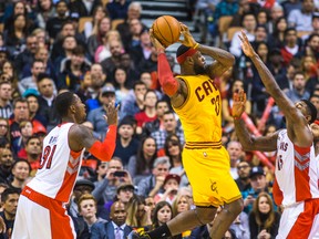 LeBron James looks to make a pass during the Cavaliers’ 105-91 win over the Raptors on Friday at the ACC. Toronto has now surrendered at least 100 points in seven straight games, the longest stretch during Dwane Casey’s tenure as head coach. (Ernest Doroszuk/Toronto Sun)