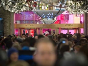 Shoppers enter Macy's to kick off Black Friday sales in New York in this file photo taken November 27, 2014.  REUTERS/Andrew Kelly/Files