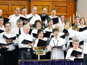 Under the direction of Ed Havenga (right), a mass choir from five churches in Mitchell and area performed during a portion of the Ecumenical Advent Service at Knox Presbyterian Church on Sunday, Nov. 30. Grace Lutheran, Knox Presbyterian, Main Street United, St. Peter’s Lutheran and St. Vincent de Paul Catholic churches were all part of the celebration, which included bell ringers, hymns, anthems, readings and prayer as another Christmas season begins. ANDY BADER/MITCHELL ADVOCATE