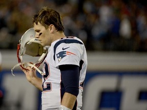 Tom Brady of the New England Patriots walks off the field against the San Diego Chargers during an NFL game at Qualcomm Stadium on December 7, 2014. (Donald Miralle/Getty Images/AFP)