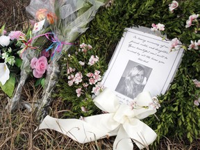 A memorial for single-vehicle collision victim Larissa Reinhardus, 22, of Quinte West, Ont. stands at the east end of Johnstown Road, near Acme Road, Monday, Dec. 8, 2014. Reinhardus was found dead when police arrived at the scene around 10:30 a.m. Saturday, Dec. 6, 2014. - JEROME LESSARD/THE INTELLIGENCER/QMI AGENCY