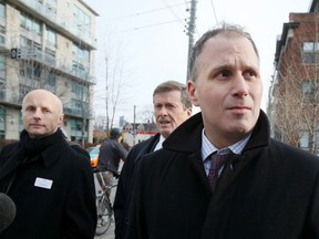 Toronto Mayor John Tory arrives at a press conference on King St. W. with TTC Chairman Josh Colle, right, and TTC CEO Andy Byford Monday December 8, 2014. (Stan Behal/Toronto Sun)