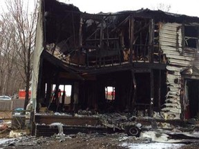 The remains of a home are seen after a plane crashed into it in Gaithersburg, Maryland, in this handout photo provided by the Montgomery County Fire & Rescue Service, December 8, 2014.  REUTERS/Montgomery County Fire & Rescue Service/Handout