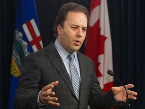Minister of Justice and Solicitor General Jonathan Denis speaks to the media about Bill 2, the Alberta Accountability Act, at the Alberta Legislature, in Edmonton, on Monday Dec. 8, 2014. (DAVID BLOOM/Edmonton Sun)