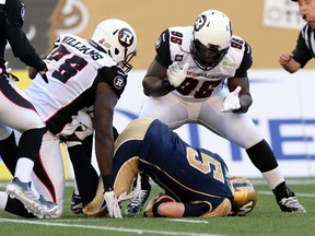 Ottawa RedBlacks defensive tackle Moton Hopkins (95) — seen here celebrating a sack of Blue Bombers quarterback Drew Willy — has scored a workout with the Minnesota Vikings. (Reuters file)