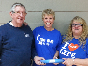 Steve Kyle 'passes the baton' to Devona Allin (centre) and Julie Dawley. CONTRIBUTED PHOTO