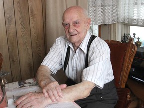 John Crausen, now 93 and living in Eastview, east of Kingston, sits in his living room. During the Second World War, he was arrested in his native Holland by the Germans, who thought he might have been a spy. (Michael Lea/The Whig-Standard)