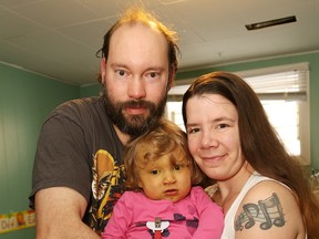JOHN LAPPA/THE SUDBURY STAR           
Elizabeth Judd poses for a picture with her partner Gilles Joly and their child, Elyarra, 2, at their home in Chelmsford. Elyarra has been diagnosed with Alagille syndrome.