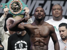 Boxing champ Floyd Mayweather, seen here at a weigh-in for one of his fights, was on a video call with Earl Hayes when the rapper killed his wife, then himself. (REUTERS file photo)