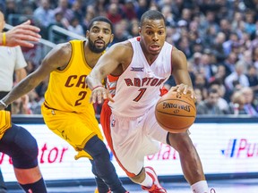Kyle Lowry of the Toronto Raptors drives past Kyrie Irving of the Cleveland Cavaliers on Dec. 5, 2014. (ERNEST DOROSZUK/Toronto Sun)