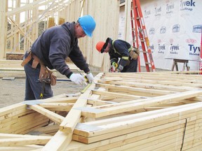 Fred Zantingh, left, and Fred Laanstra of Superiour Framing work on a new home under construction on Graham Coughtry Court in Sarnia. Housing starts are up this year in Sarnia. PAUL MORDEN/ THE OBSERVER/ QMI AGENCY