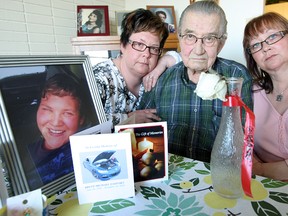 Family members (left-to-right) Melody Bodnarchuk, Peter Jaman and Connie Jaman display a memorial to Brett Yasinsky in 2011. Yasinsky was killed by a drunk driver. On Tuesday, Brad Skawretko, 35, was sentenced to 30 months in jail for the crash. (BRIAN DONOGH/WINNIPEG SUN FILE PHOTO)