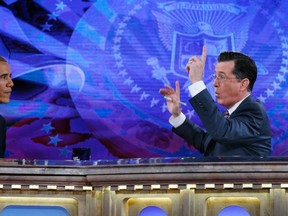 U.S. President Barack Obama appears on The Colbert Report with Stephen Colbert at the Lisner Auditorium at George Washington University in Washington on December 8, 2014. 
(REUTERS/Kevin Lamarque)