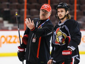 Head coach Paul MacLean and Erik Karlsson discuss tactics during Ottawa Senators practice at the Canadian Tire Centre. April 11,2014. Errol McGihon/Ottawa Sun/QMI Agency