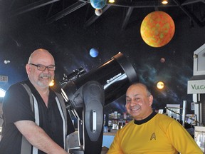 Vulcan Tourism Society Administrator Devan Daniels, left, shakes hands with Neel Roberts, who has been involved in organizing the monthly stargazing sessions at the Tourism and Trek Station since they began. This Friday’s event marks the fourth anniversary of the monthly look at celestial bodies. Stephen Tipper Vulcan Advocate