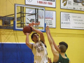 Craig Smith of the Frontenac Falcons takes a shot during a high school senior boys basketball game against the Ernestown Eagles in February 2003. (Whig-Standard file photo)