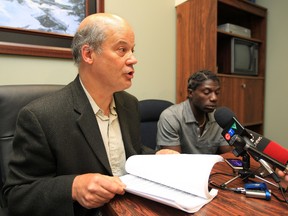 Lawyer Tom Engel and his client Kirk Steele talk to the media in Edmonton, Tuesday July 3, 2012, after Edmonton Police Service Sgt. Bruce Edwards was cleared of misconduct in the July 27, 2006 shooting of Steele. DAVID BLOOM EDMONTON SUN