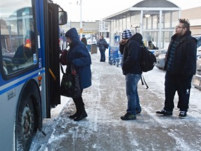 Passengers are seen boarding a bus at Capilano Transit Centre in Edmonton, Alta., on Wednesday, Jan. 30, 2013. Codie McLachlan/Edmonton Sun