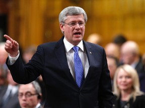 Canadian Prime Minister Stephen Harper speaks during Questino Period in the House of Commons on Parliament Hill in Ottawa, Dec. 9, 2014. (CHRIS WATTIE/Reuters)