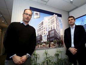 Oskar Johansson, left, and Bernard Luttmer of Podium Developments at their sales trailer for their University Suites development project at Princess Street and University Avenue. (Ian MacAlpine/The Whig-Standard)