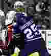 Toronto Maple Leafs'  Mike Santorelli gets hit by  Calgary Flames' Mark Giordano  in Toronto on Tuesday December 9, 2014. Craig Robertson/Toronto Sun/QMI Agency
