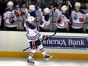 Dec 9, 2014; San Jose, CA, USA; Edmonton Oilers left wing David Perron (57) celebrates with the bench after scoring a goal against the San Jose Sharks in the first period at SAP Center. Mandatory Credit: Lance Iversen-USA TODAY.