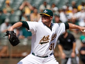 Oakland Athletics starting pitcher Jon Lester (31) pitches the ball against the Los Angeles Angels during the first inning at O.co Coliseum. (Kelley L Cox-USA TODAY Sports)