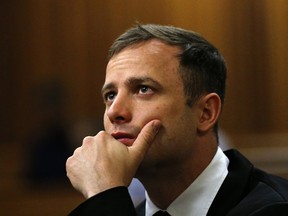 A file picture taken on October 16, 2014 shows South African paralympic athlete Oscar Pistorius waiting before his sentencing hearing in his murder trial at the North Gauteng High Court in Pretoria. (AFP PHOTO / POOL / SIPHIWE SIBEKO)
