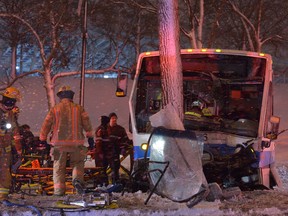 Several passengers were injured after a city bus skidded off the road and slammed into a tree in Montreal on Tuesday night. (ERIK PETERS/QMI Agency)