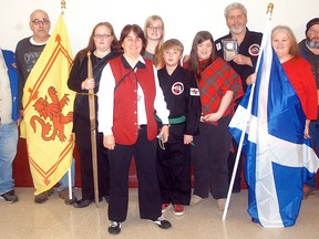 Knights of Pythias members Joe Janssens, far left, and Jerry Blake, far right, award the Best Parade Theme Float award for the Wallaceburg Knights of Pythias Parade which was held on Saturday, November 15, 2014. Accepting the award is the Wallaceburg Martial Arts members; Don Eagleson, Jennifer Eagleson, Lise Cyr, Mikaila Payne, Walker Payne, Rebecca Eagleson, Henrie Timmers and Karen Eagleson.