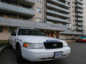 A Toronto Police cruiser sits outside a High Park Ave. apartment Wednesday, Dec. 10, 2014. A man in his 50s was stabbed Tuesday around 8:40 p.m. and later died in hospital. A man in his 20s is charged with second-degree murder. (Jack Boland/Toronto Sun)