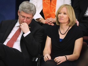 Prime Minister Stephen Harper sits with his wife Laureen after he made an announcement about the "Victims Bill of Rights" legislation in Mississauga, Ont., in this April 3, 2014 file photo. (REUTERS/Mark Blinch)