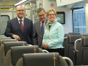 Ontario Premier Kathleen Wynne checks out the new UP Express rail link between Pearson Airport and Union Station in Toronto on Dec. 10 2014. She was joined by Transportation Minister Steven Del Duca (left) and Metrolinx president and CEO Bruce McCuaig. (Antonella Artuso/Toronto Sun)