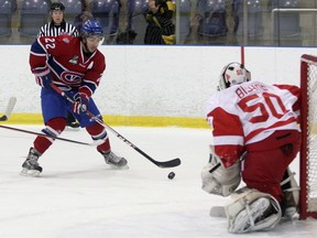 Kingston Voyageurs forward Alex Tonge moves in on Hamilton Red Wings goalie Alex Bishop during Ontario Junior Hockey League action at the Invista Centre on Oct. 16. (Ian MacAlpine/The Whig-Standard)