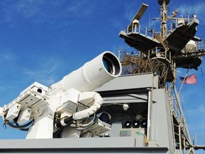 In this November 16, 2014 US Navy handout image the Afloat Forward Staging Base (Interim) USS Ponce (ASB(I) 15) conducts an operational demonstration of the Office of Naval Research (ONR)-sponsored Laser Weapon System (LaWS) while deployed to the Gulf. AFP PHOTO / HANDOUT / US NAVY / JOHN F. WILLIAMS / RELEASED