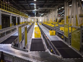 Conveyor belts carry goods at an Amazon Fulfillment Center, ahead of the Christmas rush, in Tracy, California, Nov. 30, 2014. REUTERS/Noah Berger