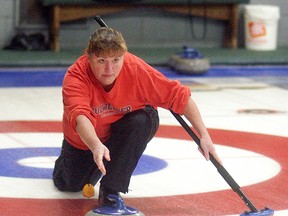 Sue Poole delivers a rock during the eighth annual Sue Talach Memorial bonspiel held at the Sydenham Community Curling Club on Saturday, December 6, 2014. The bonspiel was expected to raise $4-$5,000 for the Susan Talach Memorial Book Fund. A total of 64 curlers from all over Ontario took part. Overall, over $40,000 has been raised for the fund, which honours Talach who was a local teacher and librarian. The fund provides books and literacy materials for A.A. Wright public school. The fund used to help out D.A. Gordon public school, but the school closed earlier this year.