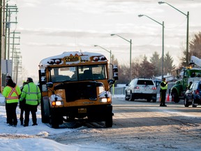 A school bus that was involved in a collision with a vehicle on Dahl Dr. at 55 Ave. in Whitecourt, Alta. on the morning of Monday, Nov. 14, 2014 is pictured pulled to the side of the road on 55 Ave. No injuries were reported and another bus arrived quickly to take the kids to school.

Adam Dietrich | Whitecourt Star