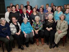 Lady Minto Hopstial Auxiliary volunteers and special guests pose at the Ice Hut during last Tuesday's annual Lady Minto Auxiliary Christmas Lunch.