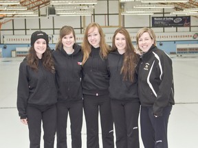 The Cochrane Curling Club's Junior Girls Hilary Groulx,  Brittany Martin, Calie DeJoseph, and Katelyn Dumoulin pose with their coach Julie Seim at the Cochrane Curling Club.