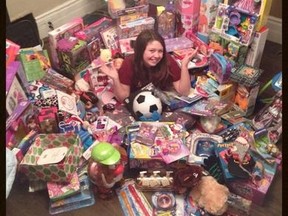 Emma Chilvers, 11, of St. Thomas is surrounded by her birthday loot, only the she?s not keeping the gifts. Emma told family and friends she wanted to help the less forunate at Christmas and collected 14 boxes of gifts. (Submitted photo)