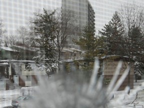 Bullet holes in the window of a Penny Drive house in Ottawa Thursday Dec 11, 2014. Tony Caldwell/Ottawa Sun/QMI Agency